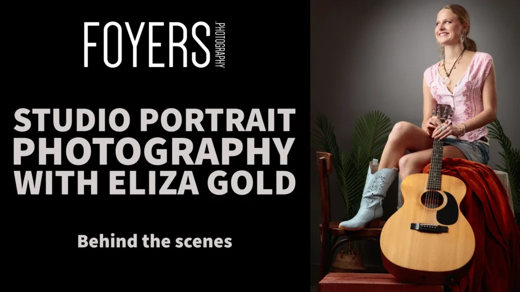 Studio portrait session with woman and guitar.